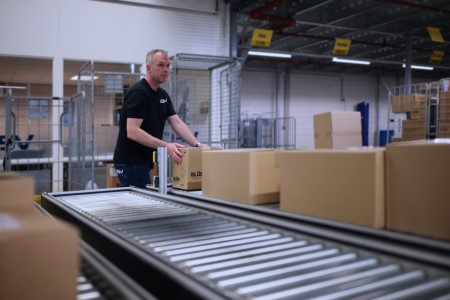 DSV employee handling packaging at the fulfilment DSV warehouse | DSV Direct Blog